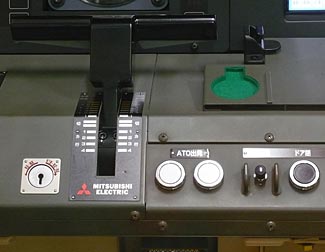 In this Japanese semi-automatic train control system, all the 'driver' now does is push the two white buttons to start the train.